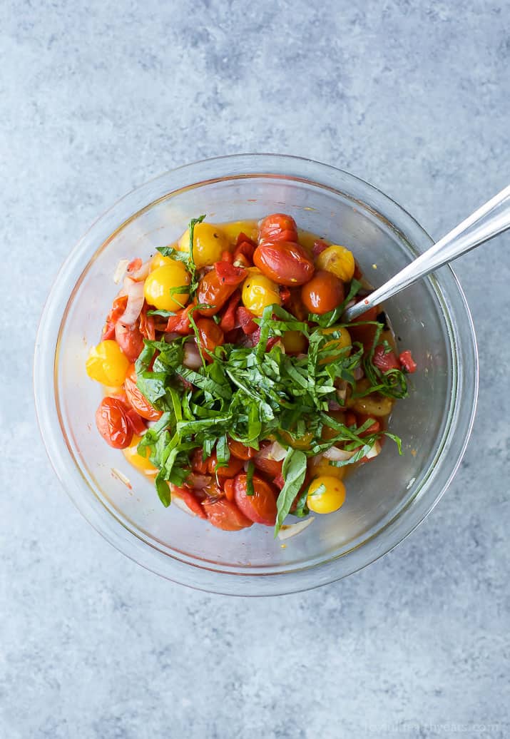 Top view of Roasted Red Pepper and Charred Tomato Relish ingredients in a mixing bowl