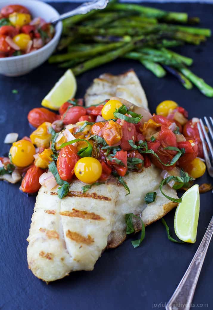 Close-up of Grilled Red Snapper topped with a Roasted Red Pepper and Charred Tomato Relish