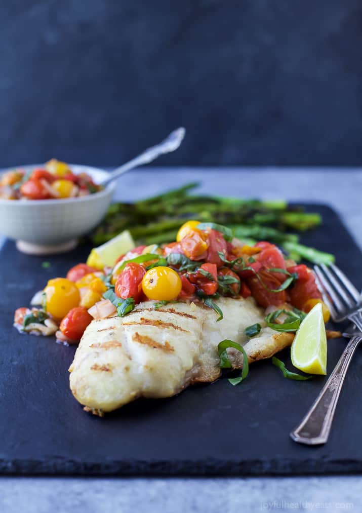 Close-up of Grilled Red Snapper topped with a Roasted Red Pepper and Charred Tomato Relish