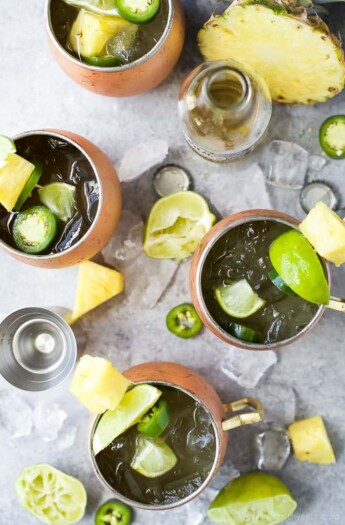 A Pineapple infused Moscow Mule topped with Jalapeno for a spicy kick. This refreshing sip will be your new favorite cocktail this summer!