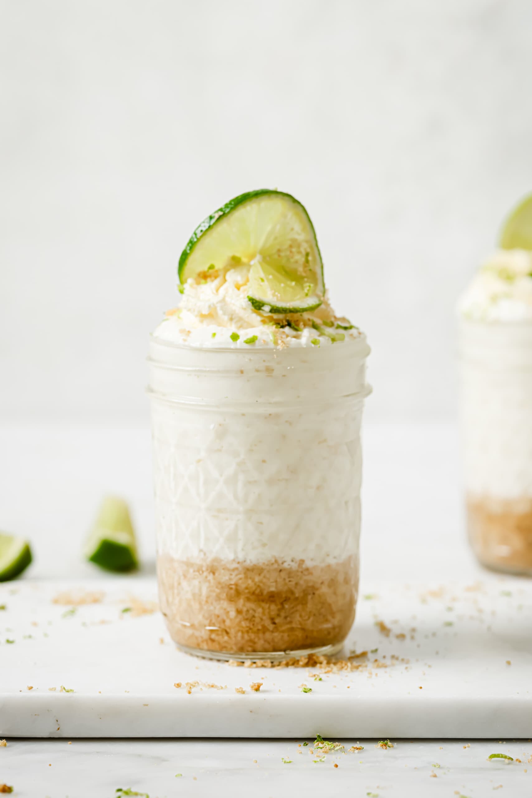 Side shot of key lime cheesecake in a jar. 