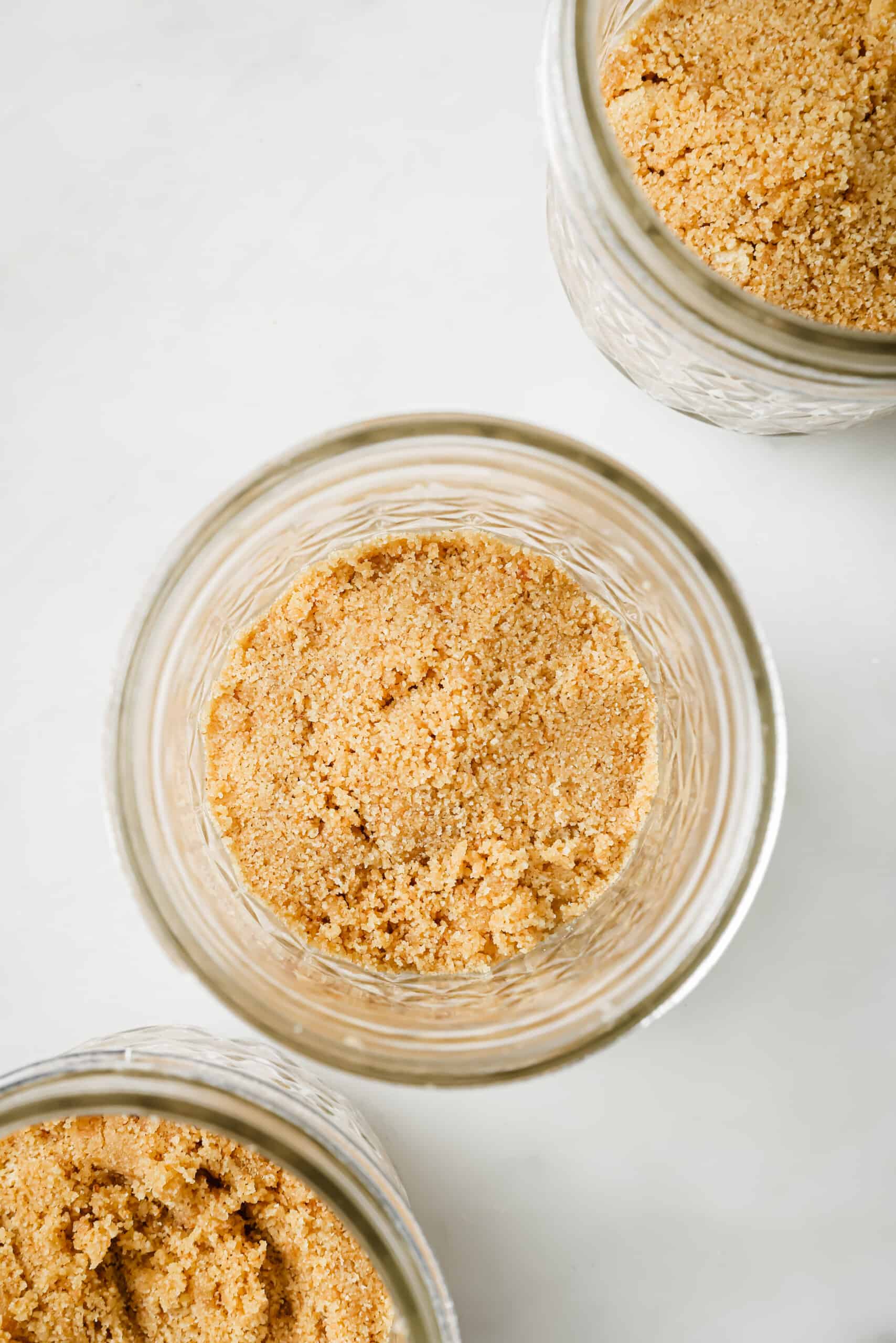 Placing the crust in the jars. 