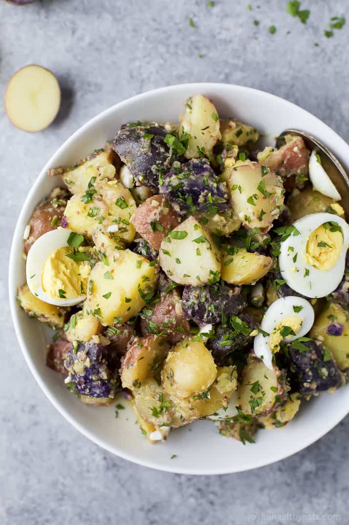 Patriotic Potato Salad made with red, white, and blue potatoes then covered with a easy light Herb Vinaigrette. The perfect side dish to bring to your next party!