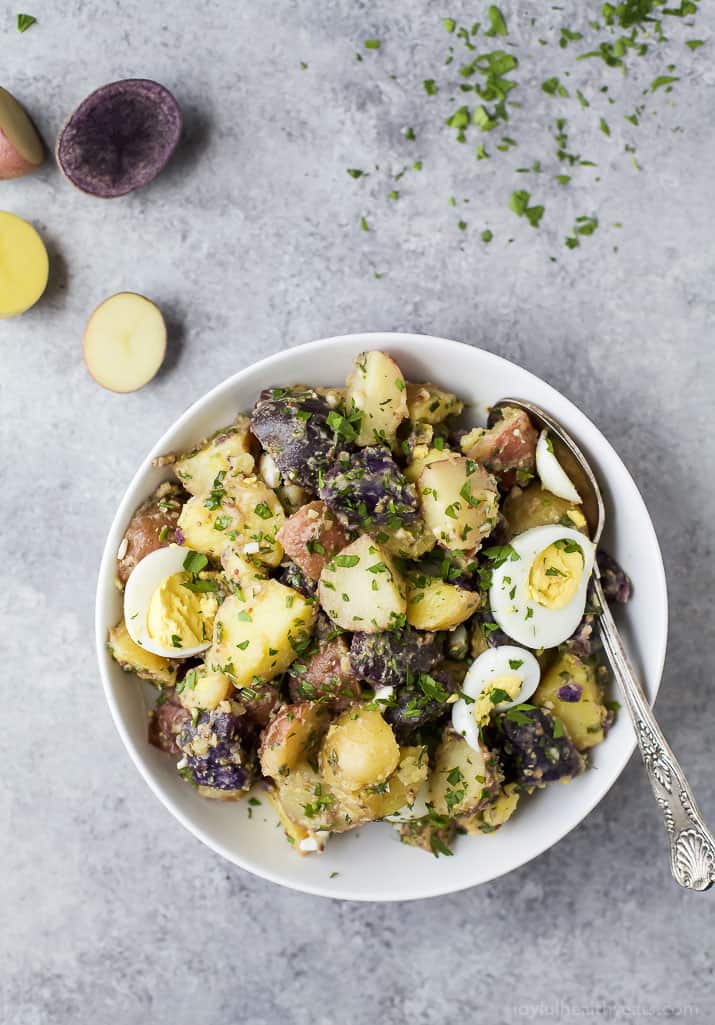 Patriotic Potato Salad made with red, white, and blue potatoes then covered with a easy light Herb Vinaigrette. The perfect side dish to bring to your next party!