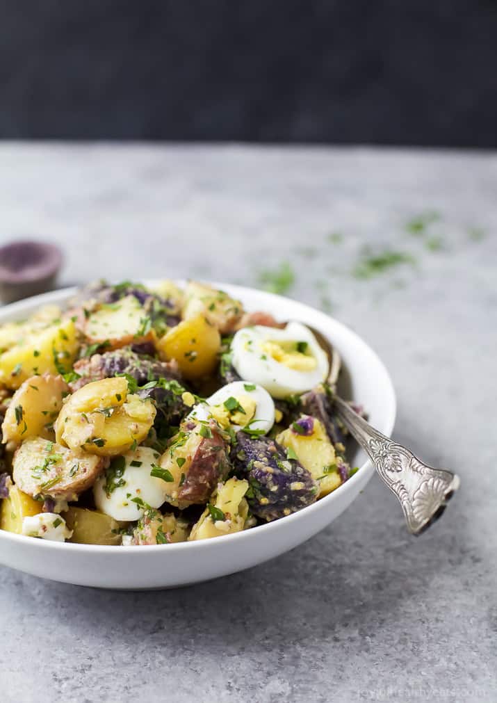 Patriotic Potato Salad made with red, white, and blue potatoes then covered with a easy light Herb Vinaigrette. The perfect side dish to bring to your next party!
