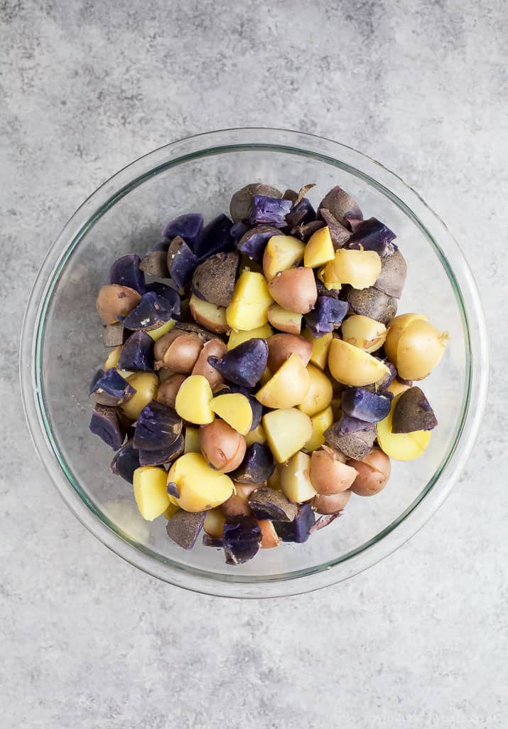 Patriotic Potato Salad made with red, white, and blue potatoes then covered with a easy light Herb Vinaigrette. The perfect side dish to bring to your next party!