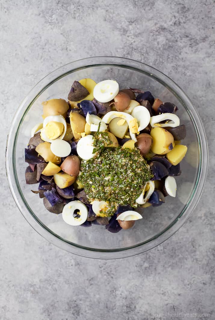 Patriotic Potato Salad made with red, white, and blue potatoes then covered with a easy light Herb Vinaigrette. The perfect side dish to bring to your next party!