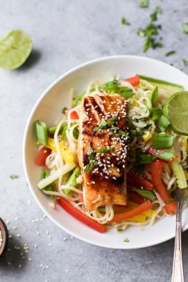 teriyaki salmon with asian noodle salad on a plate