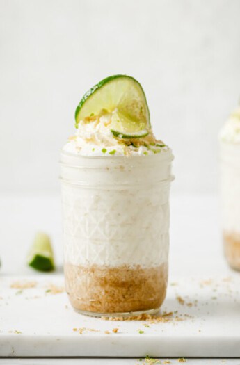 Side shot of key lime cheesecake in a jar.