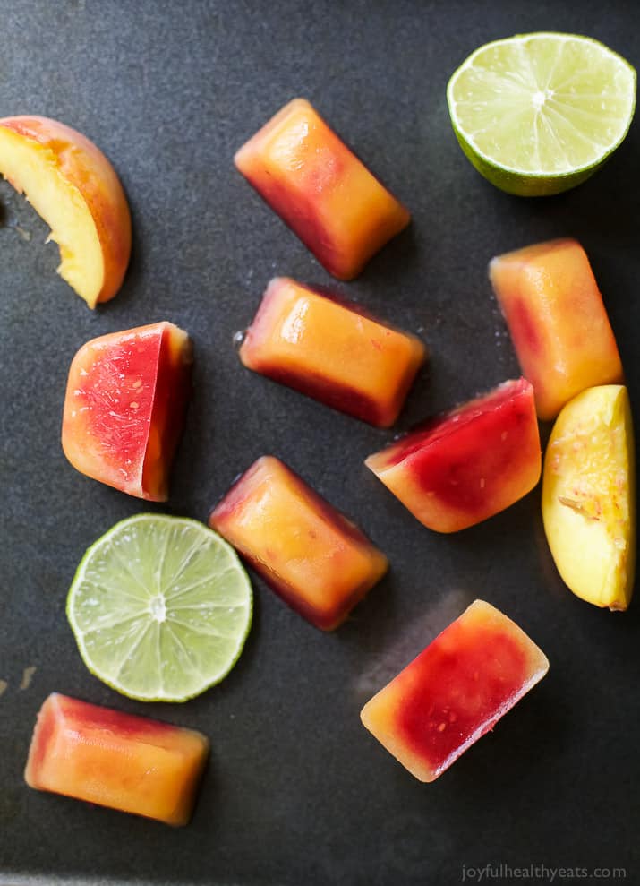 Rosé Wine with Homemade Fresh Fruit Cubes made with raspberries and peach - a perfect refreshing cocktail for the summer!