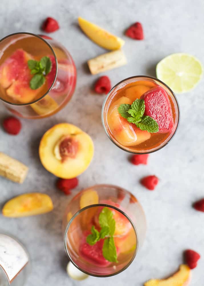 Rosé Wine with Homemade Fresh Fruit Cubes made with raspberries and peach - a perfect refreshing cocktail for the summer!