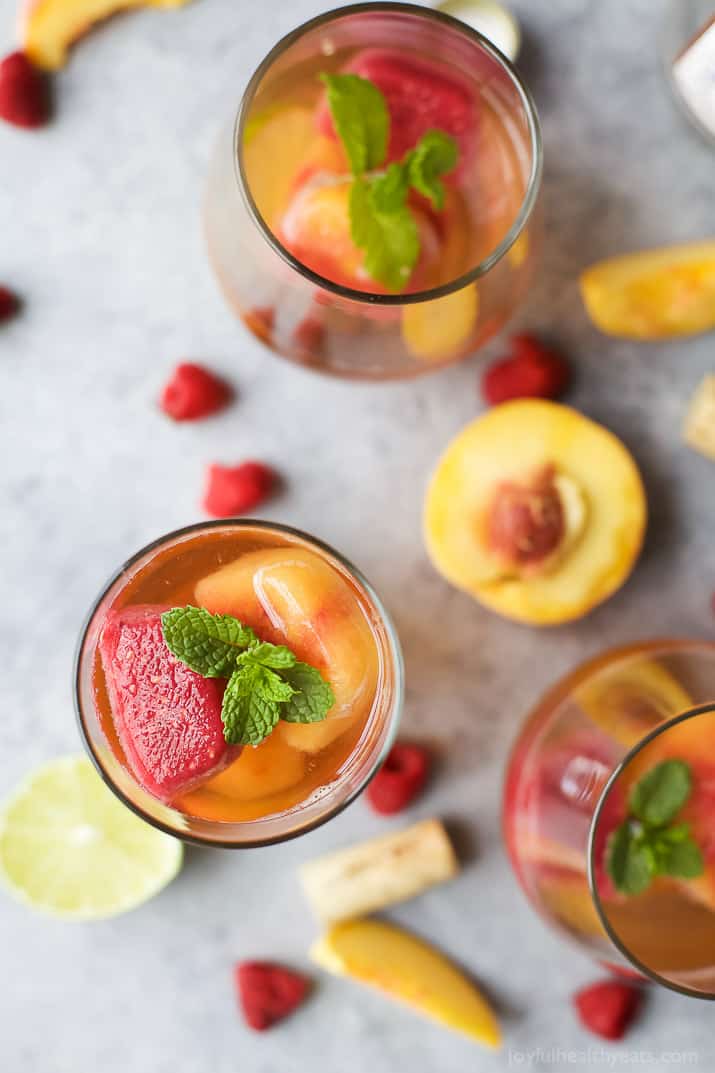 Rosé Wine with Homemade Fresh Fruit Cubes made with raspberries and peach - a perfect refreshing cocktail for the summer!