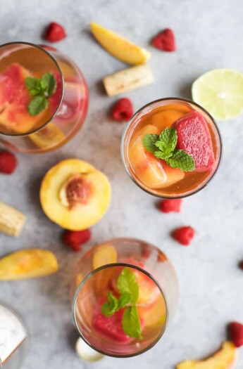 Rosé Wine with Homemade Fresh Fruit Cubes made with raspberries and peach - a perfect refreshing cocktail for the summer!
