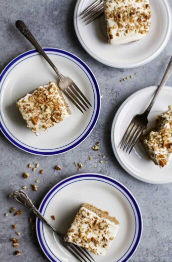 Moist Healthy Zucchini Cake made with applesauce and honey then topped with a light Cream Cheese Frosting! It's the ultimate dessert recipe or late night sweet treat!