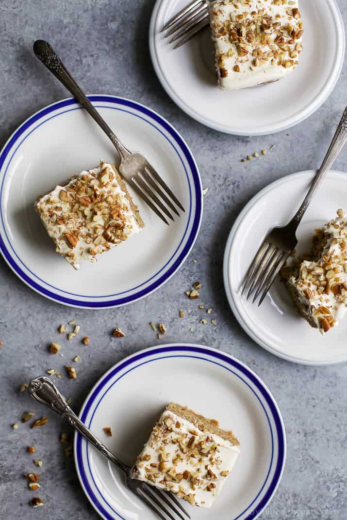 Moist Healthy Zucchini Cake made with applesauce and honey then topped with a light Cream Cheese Frosting! It's the ultimate dessert recipe or late night sweet treat!