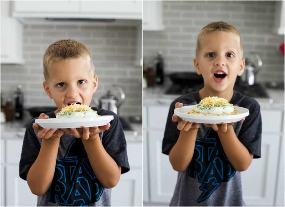 A little boy with a plate of Bacon Egg White Breakfast Pizza