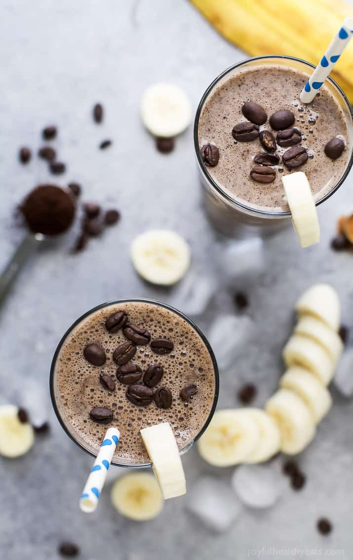Top view of two glasses of Cafe Mocha Smoothie with coffee beans on top