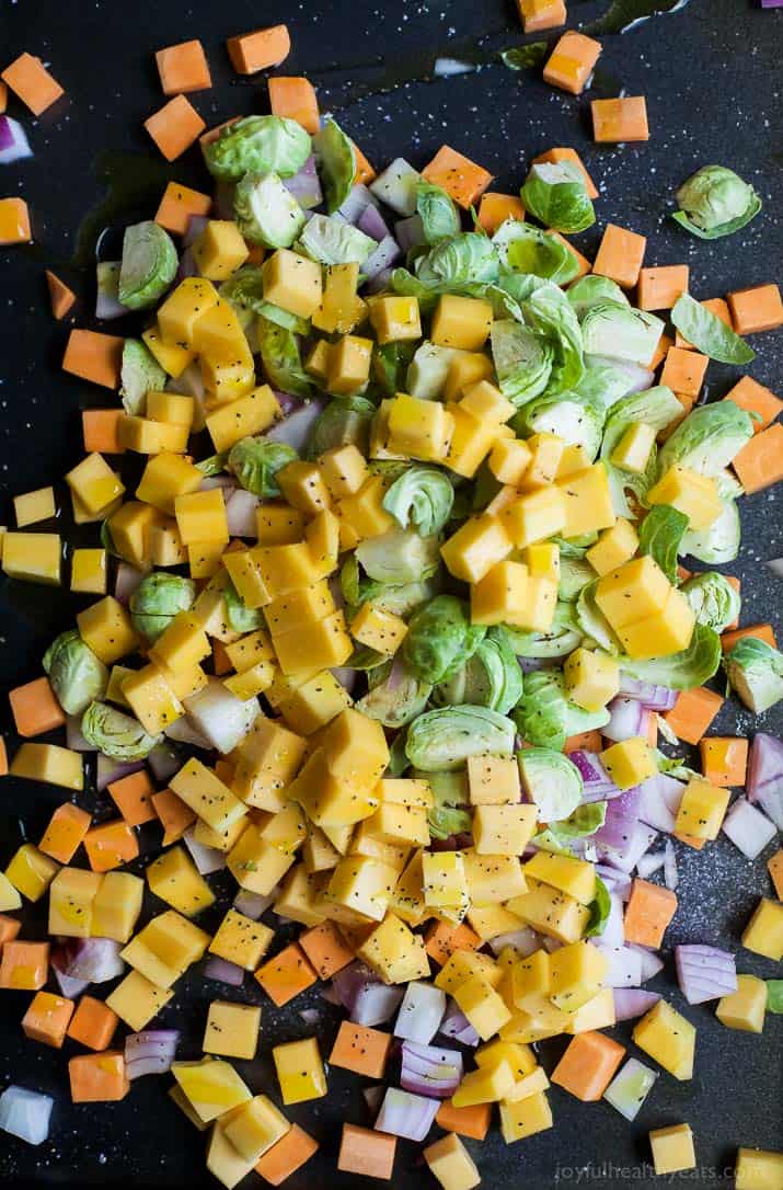 Top view of diced fall vegetables on a roasting pan