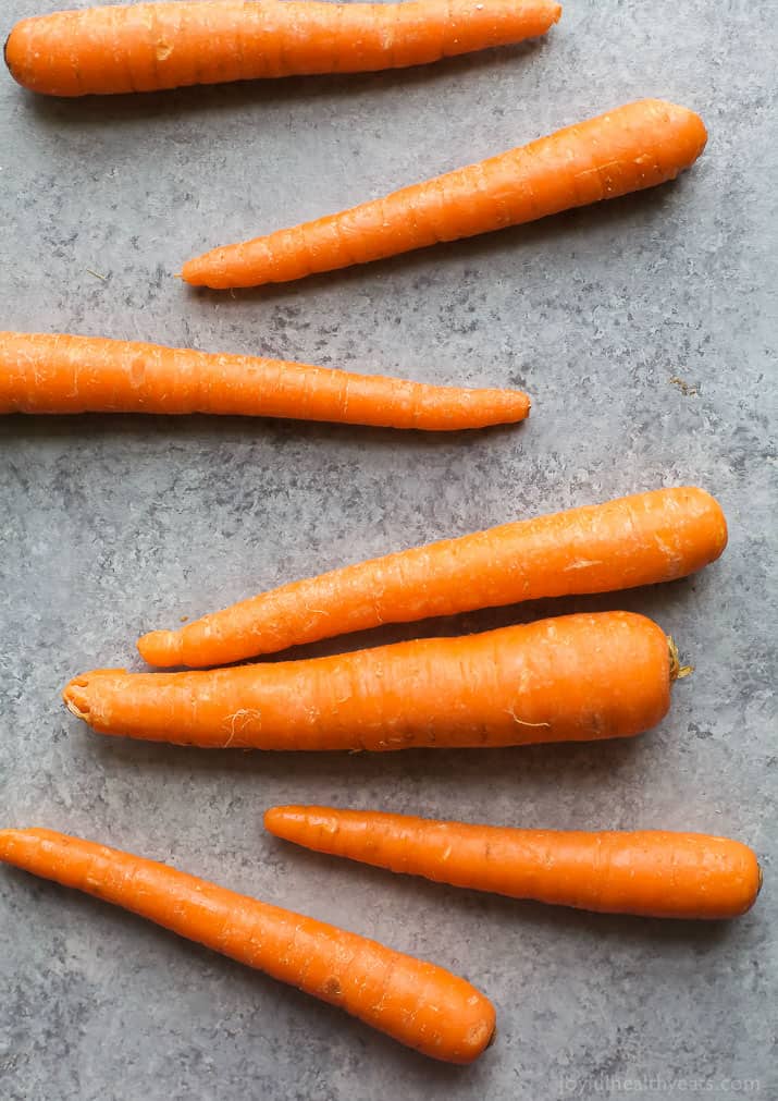 Several whole raw carrots