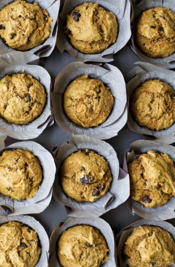 Healthy Carrot Cake Muffins sweetened with applesauce and maple syrup. These Muffins are insanely moist and taste just like carrot cake but without all the guilt! Perfect for a grab'n go breakfast or afternoon snack!