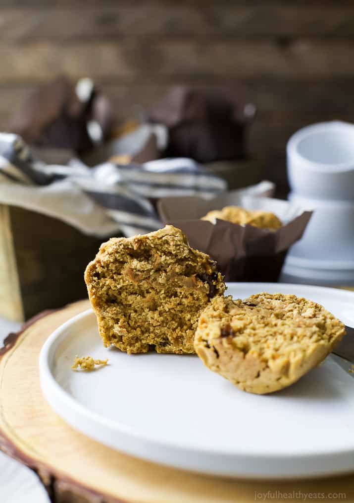 Two halves of a Healthy Carrot Cake Muffin on a plate