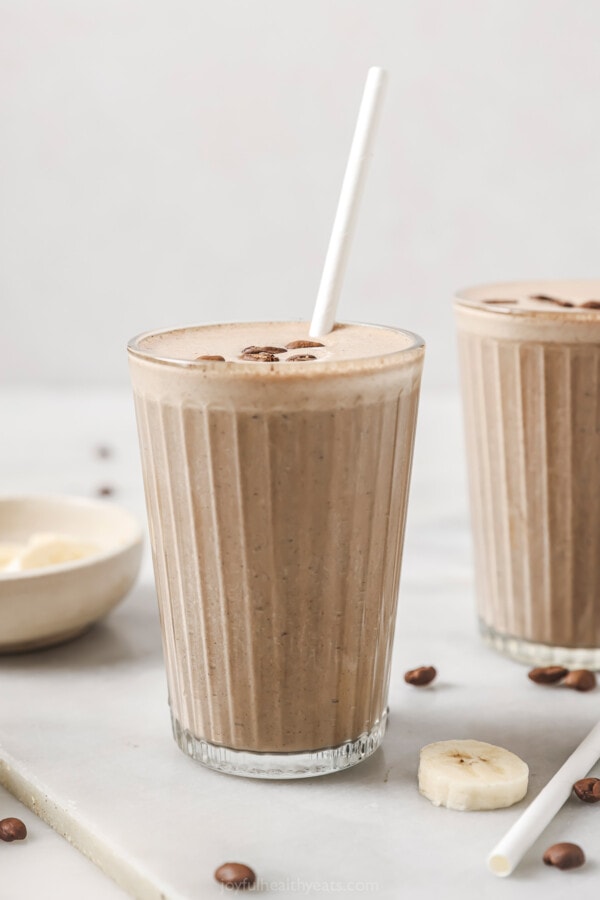 Mocha smoothie with a straw.