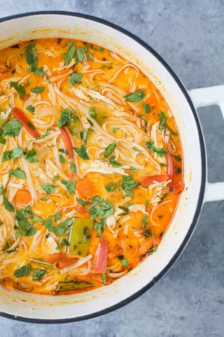 30 Minute Thai Chicken Noodle Soup filled with curry and coconut flavor, chicken, veggies and rice noodles! An epic soup recipe that will soon be your families favorite + it's gluten free!