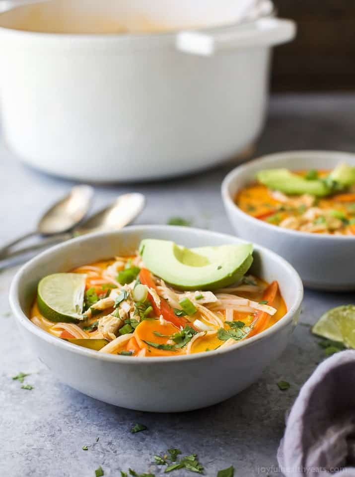 30 Minute Thai Chicken Noodle Soup filled with curry and coconut flavor, chicken, veggies and rice noodles! An epic soup recipe that will soon be your families favorite + it's gluten free!