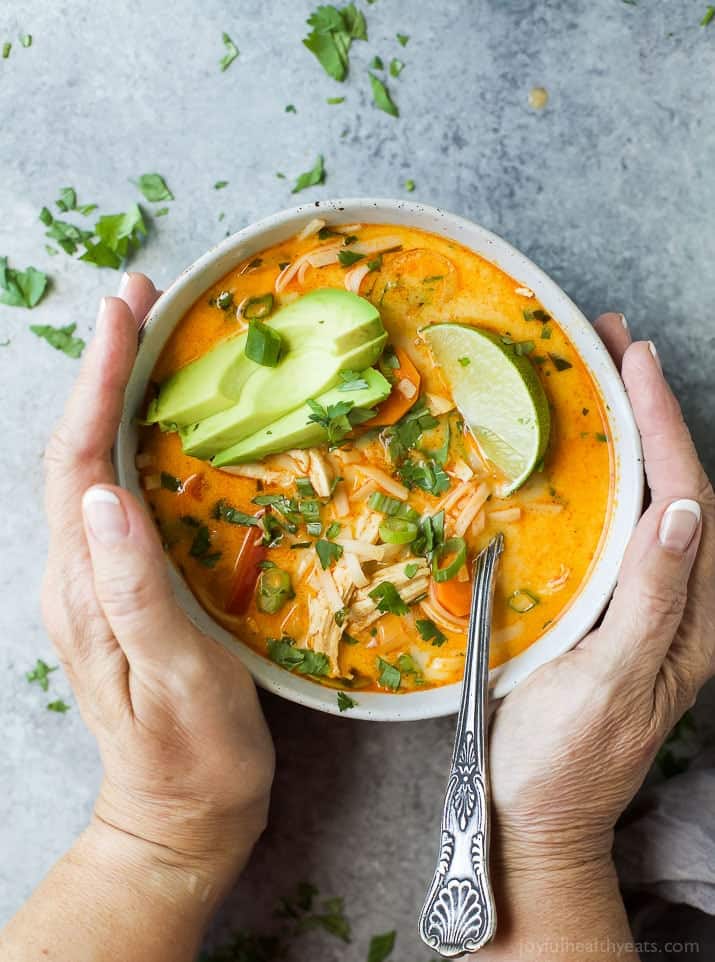 30 Minute Thai Chicken Noodle Soup filled with curry and coconut flavor, chicken, veggies and rice noodles! An epic soup recipe that will soon be your families favorite + it's gluten free!