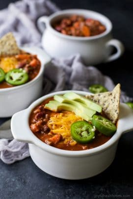 30 minute beef chili recipe in a bowl topped with avocado and cheese