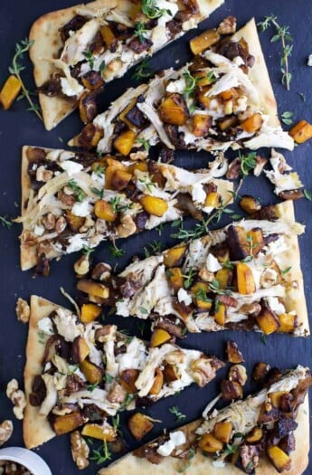 Butternut Squash Chicken Flatbread Pizza with balsamic caramelized onions and goat cheese. An easy pizza recipe that comes together in less than 30 minutes, or serve this as an appetizer at your next holiday party!