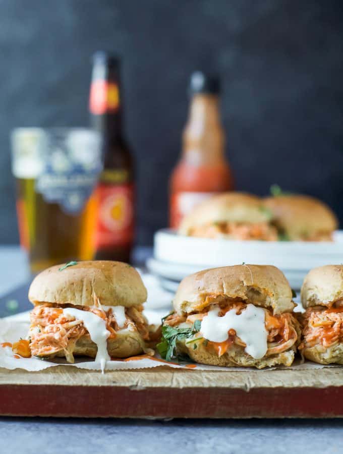 Baked Cheesy Buffalo Chicken Sliders made in less than 30 minutes and using only 5 ingredients! Loaded with Buffalo Chicken flavor these sliders are the perfect game day recipe!