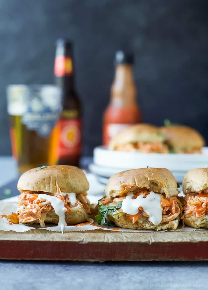 Baked Cheesy Buffalo Chicken Sliders on a wooden board