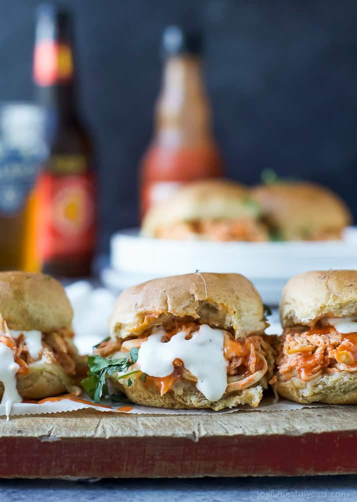 Baked Cheesy Buffalo Chicken Sliders on a wooden board