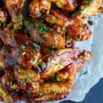 Crispy Honey BBQ Chicken Wings - baked instead of fried these classic chicken wings are crispy, tender and smothered in a sweet 'n spicy Honey BBQ Sauce! A definite crowd pleaser and the perfect game day recipe!