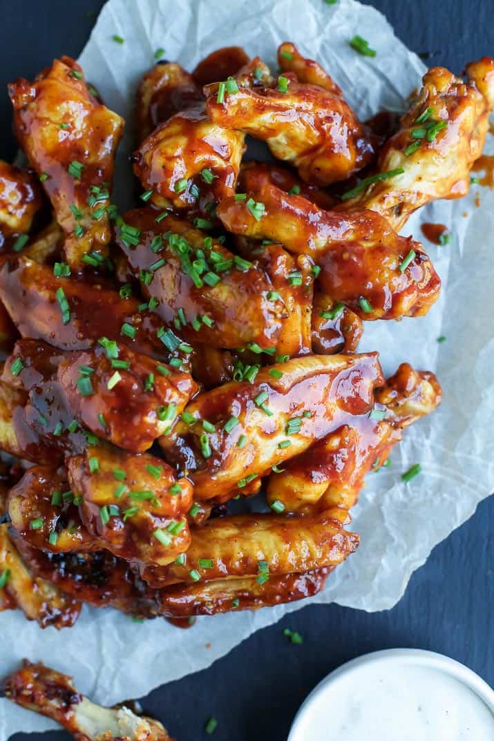 Crispy Honey BBQ Chicken Wings - baked instead of fried these classic chicken wings are crispy, tender and smothered in a sweet 'n spicy Honey BBQ Sauce! A definite crowd pleaser and the perfect game day recipe!