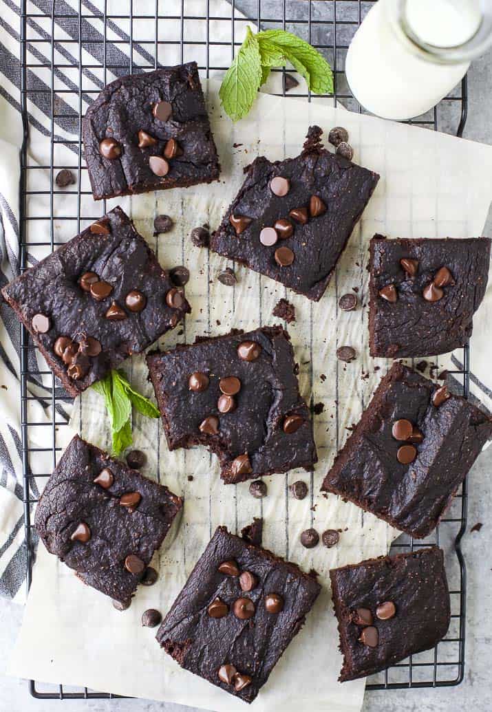 A Piece of Parchment Paper Over a Cooling Rack with Gluten Free Pumpkin Brownies on Top