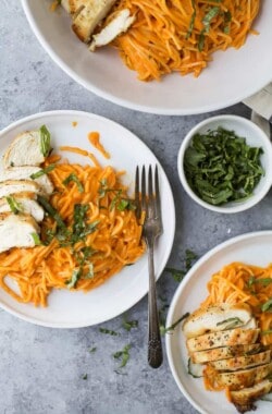Gluten Free Pasta served with pan seared Chicken and a Creamy Roasted Red Pepper Sauce - made in 30 minutes! This gluten free pasta recipe is easy, comforting and guaranteed to be a family favorite!!