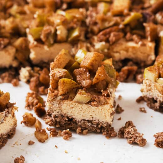 Close-up of a slice of an apple cheesecake bar.