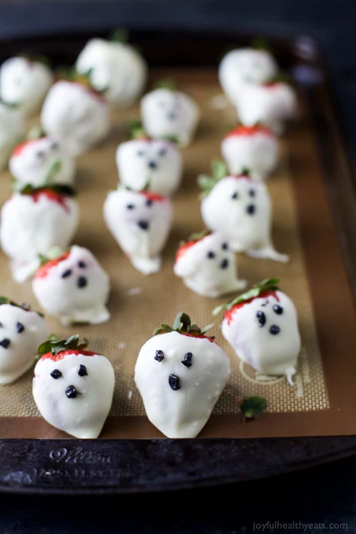 White Chocolate Covered Strawberry Ghosts on a baking mat
