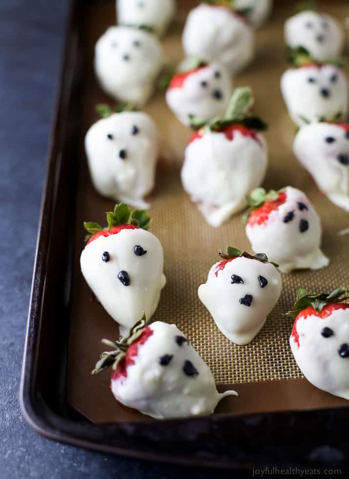 White Chocolate Covered Strawberry Ghosts on a baking sheet