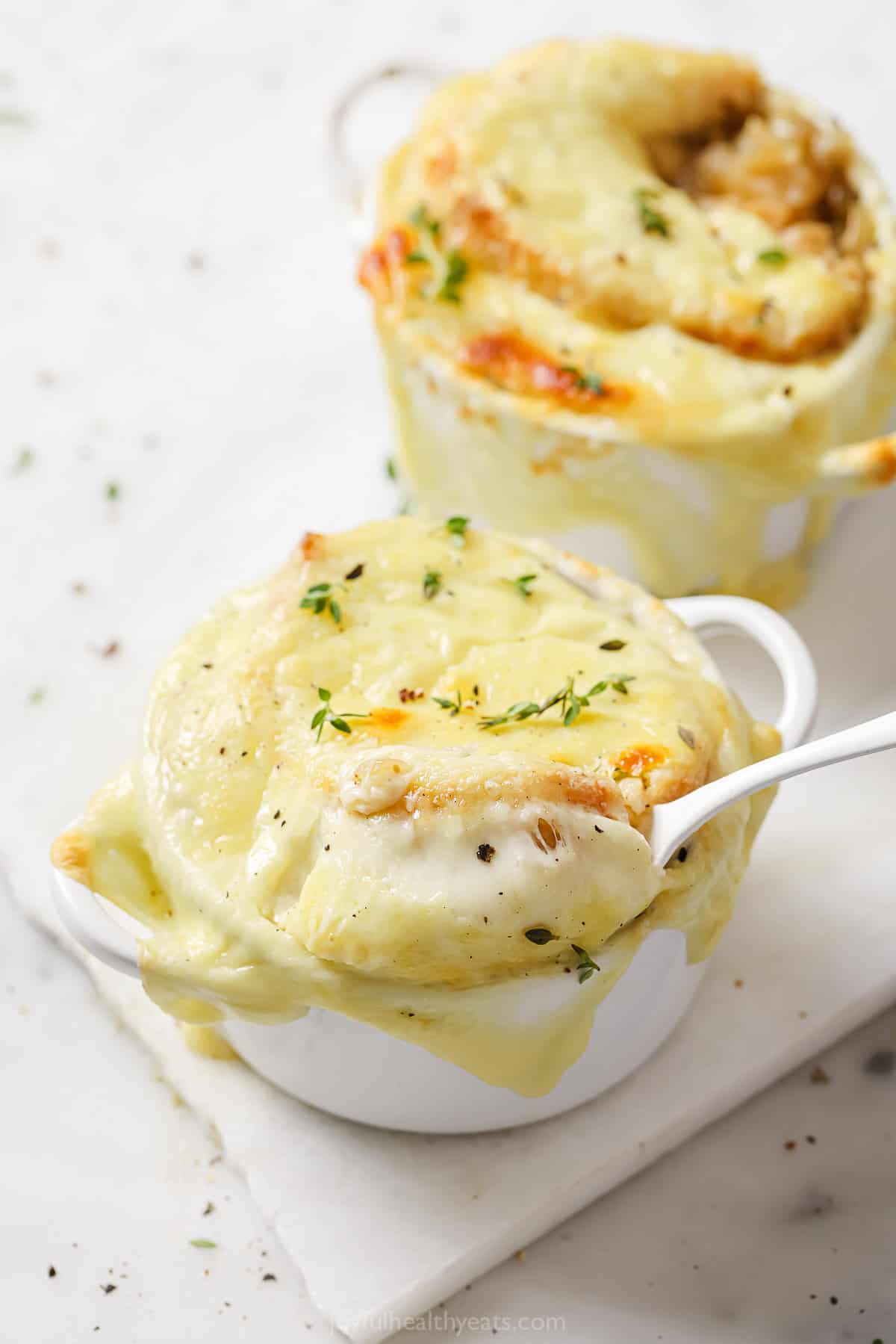 French onion soup recipe with a cheese pull.