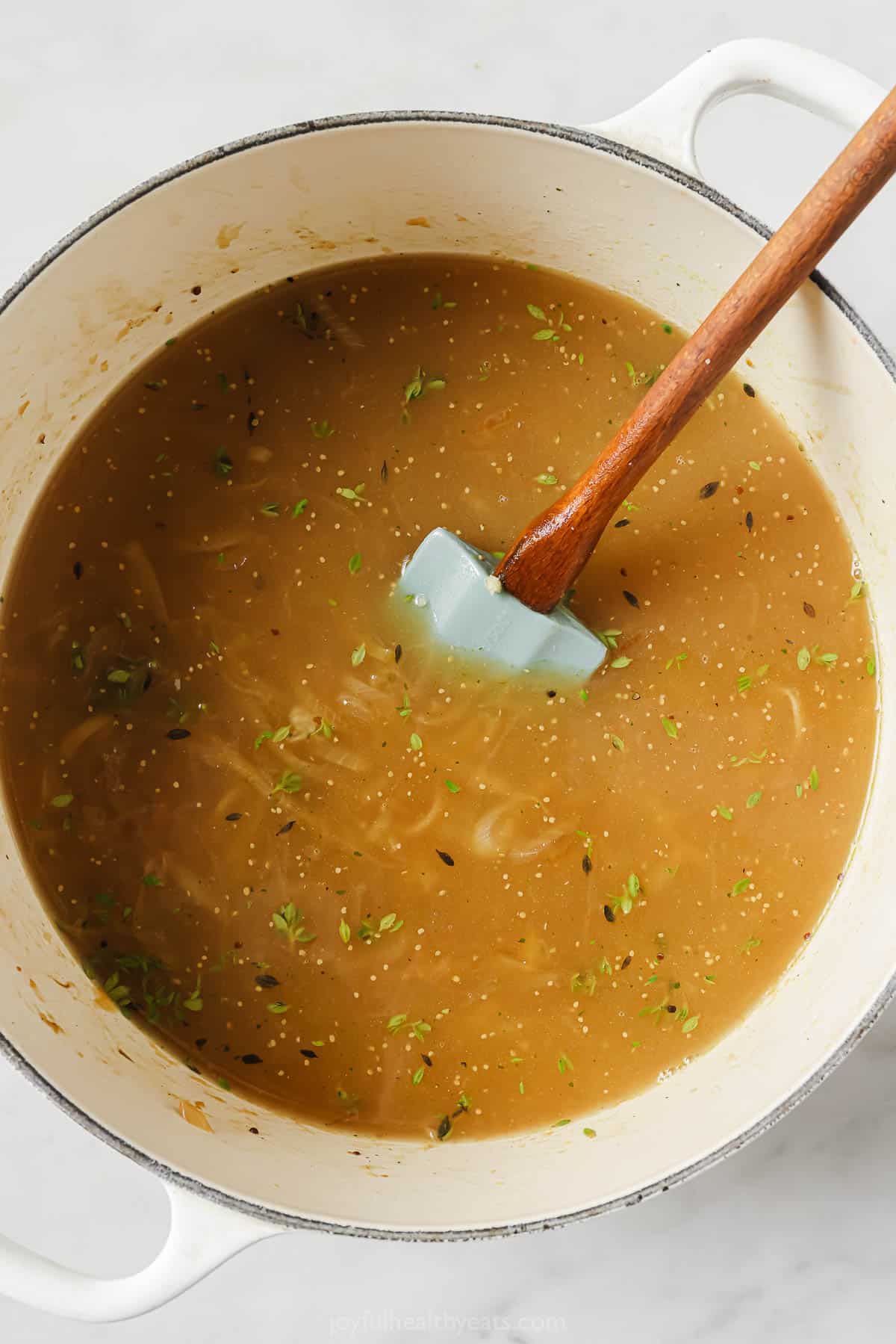 Adding the wine and beef broth. 