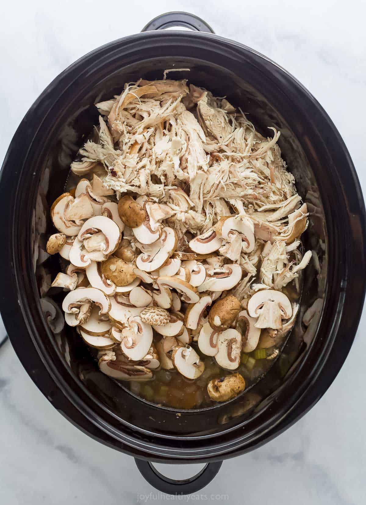 This creamy Crockpot Chicken and Wild Rice Soup is filled with wild rice, tender chicken, and veggies. Only 5 minutes of prep time! mushrooms in a crock pot