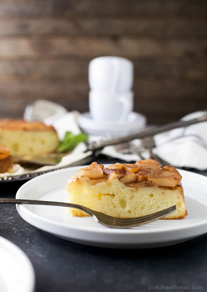 This tender pear upside-down cake recipe with homemade spiced caramel is a fancy-yet-easy dessert for the holidays. A close-up of a moist, tender crumbly pear upside-down cake.