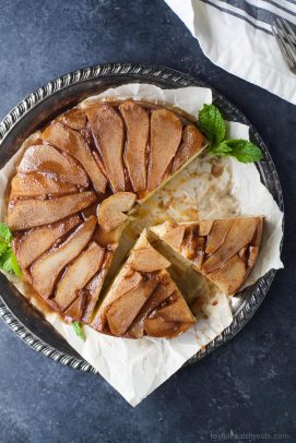 spiced pear upside down cake on a serving platter