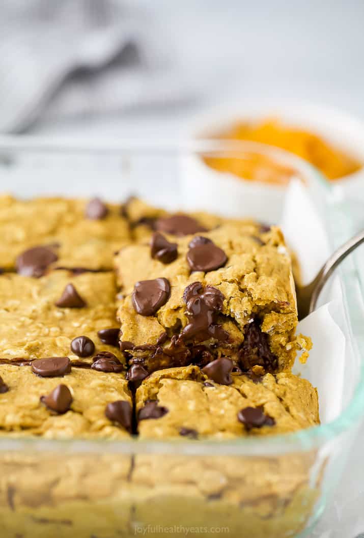 spatula pulling out oatmeal pumpkin bars from a dish