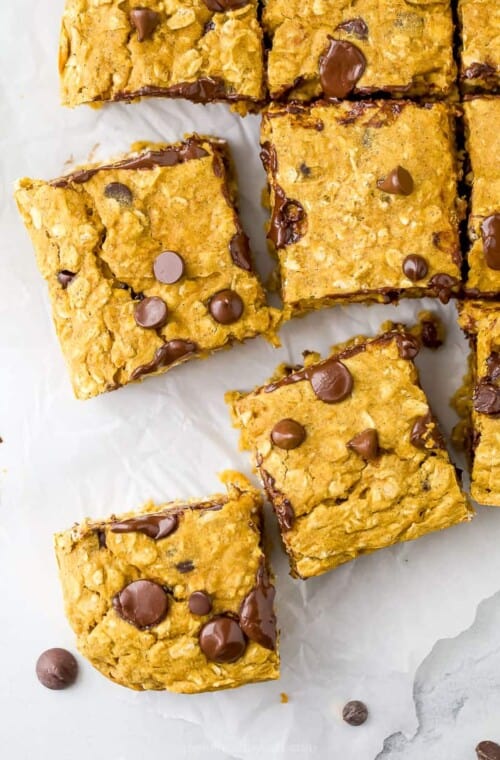 pumpkin chocolate chips spread out on a board