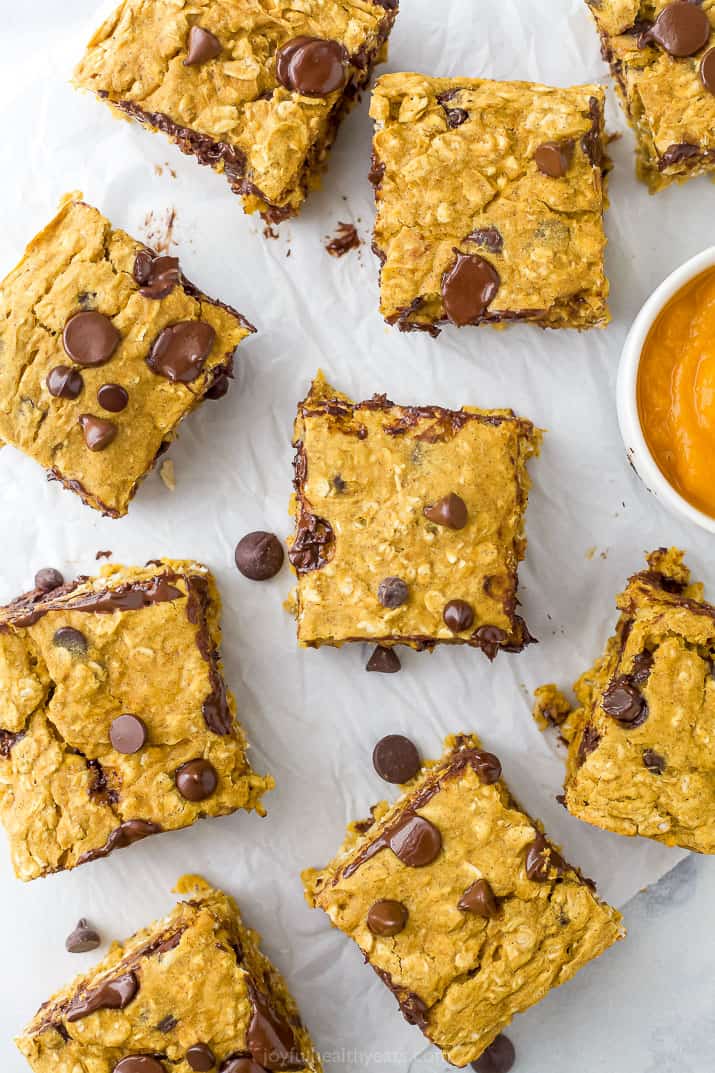 pumpkin bars with chocolate spread out on a board with pumpkin puree