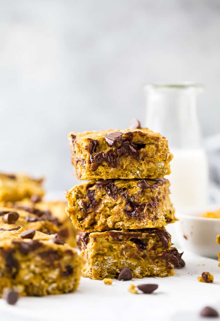 pumpkin bars with chocolate chips stacked on top of each other